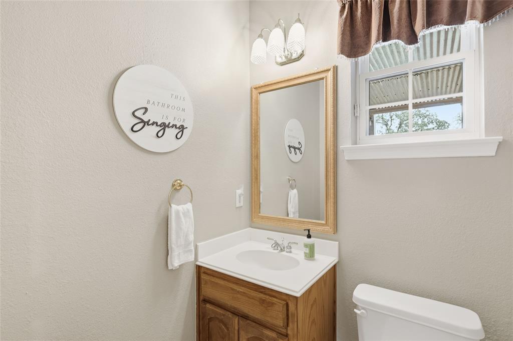 4800 Shiloh Road Double Oak, TX 75022 - Photo 15 of 40 a bathroom with a toilet and a sink