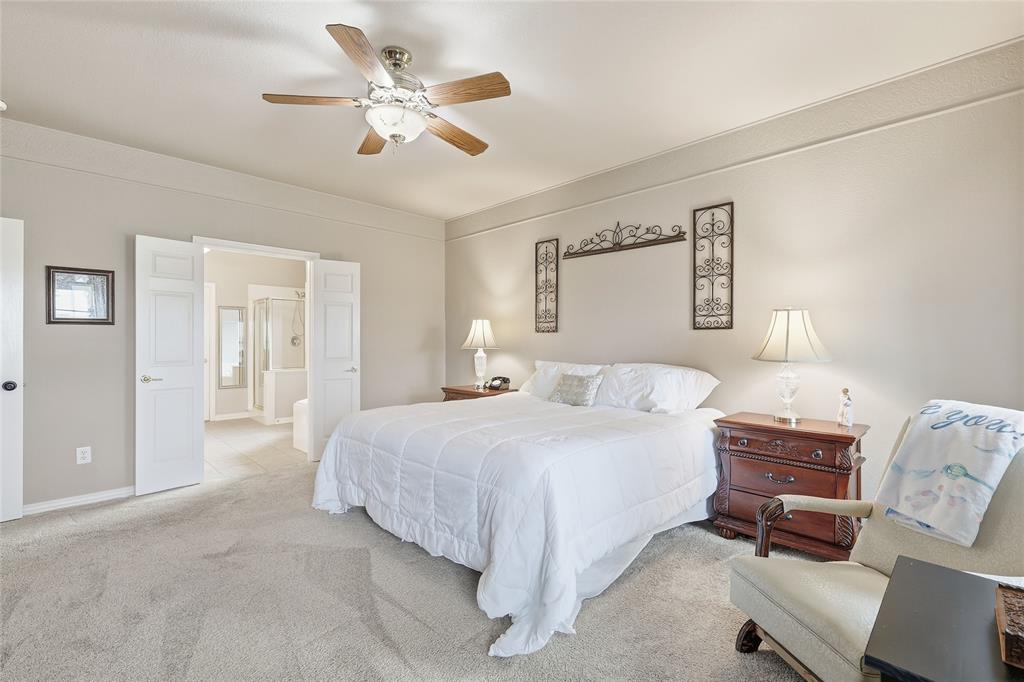 4800 Shiloh Road Double Oak, TX 75022 - Photo 16 of 40 a bedroom with a bed gym equipment and a desk