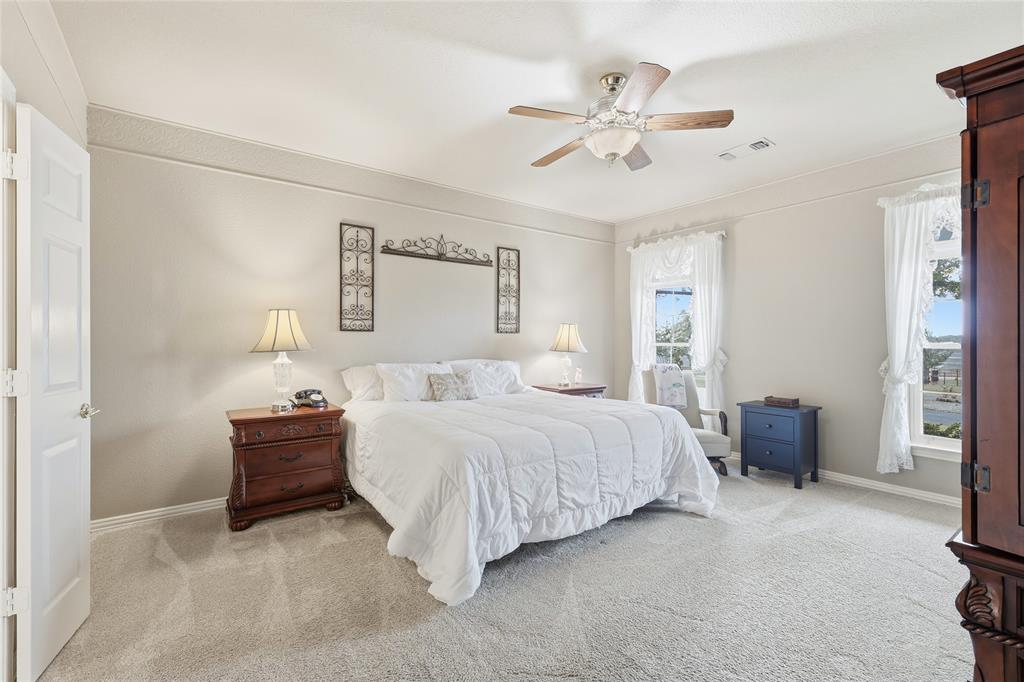 4800 Shiloh Road Double Oak, TX 75022 - Photo 17 of 40 a bedroom with bed and window