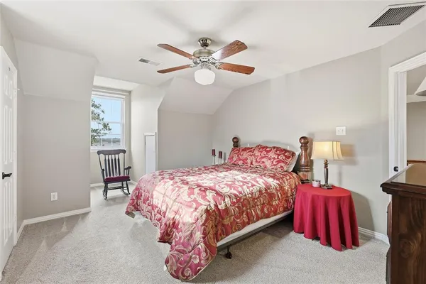 an aerial view of a house with a yard basket ball court