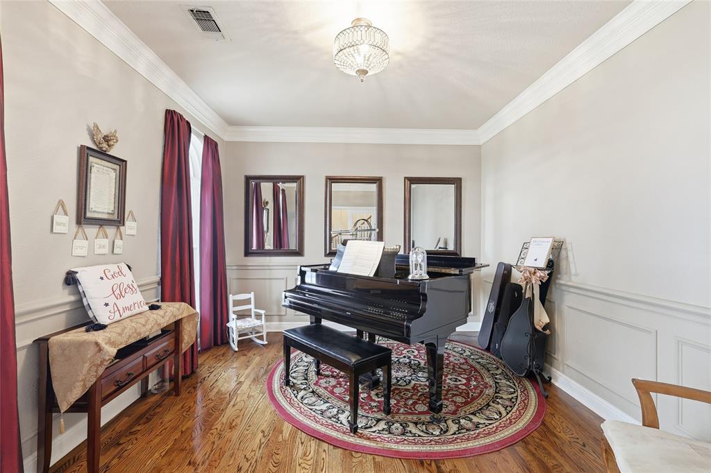 4800 Shiloh Road Double Oak, TX 75022 - Photo 28 of 40 a living room with furniture and a chandelier