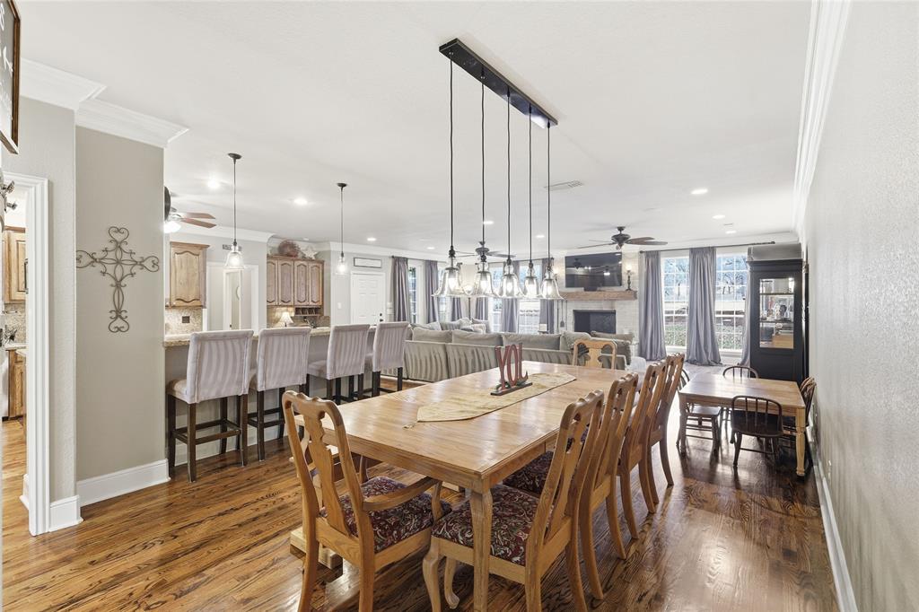4800 Shiloh Road Double Oak, TX 75022 - Photo 29 of 40 a view of a dining room with furniture and wooden floor