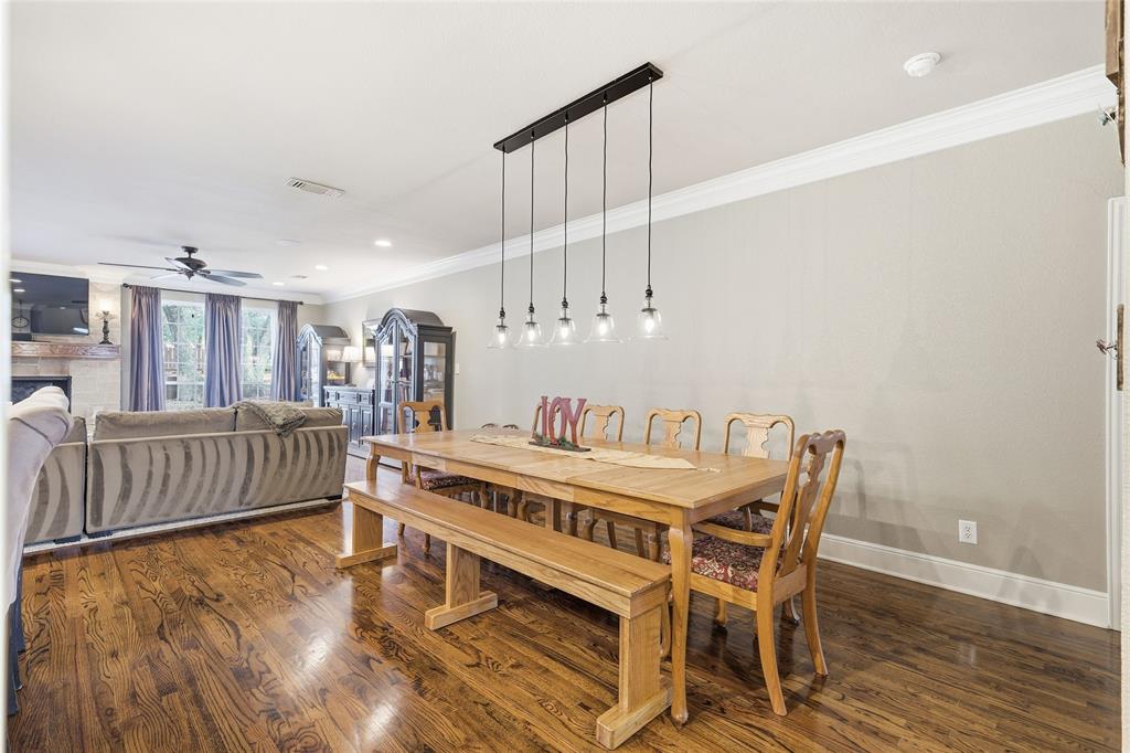 4800 Shiloh Road Double Oak, TX 75022 - Photo 30 of 40 a dining room with furniture and wooden floor
