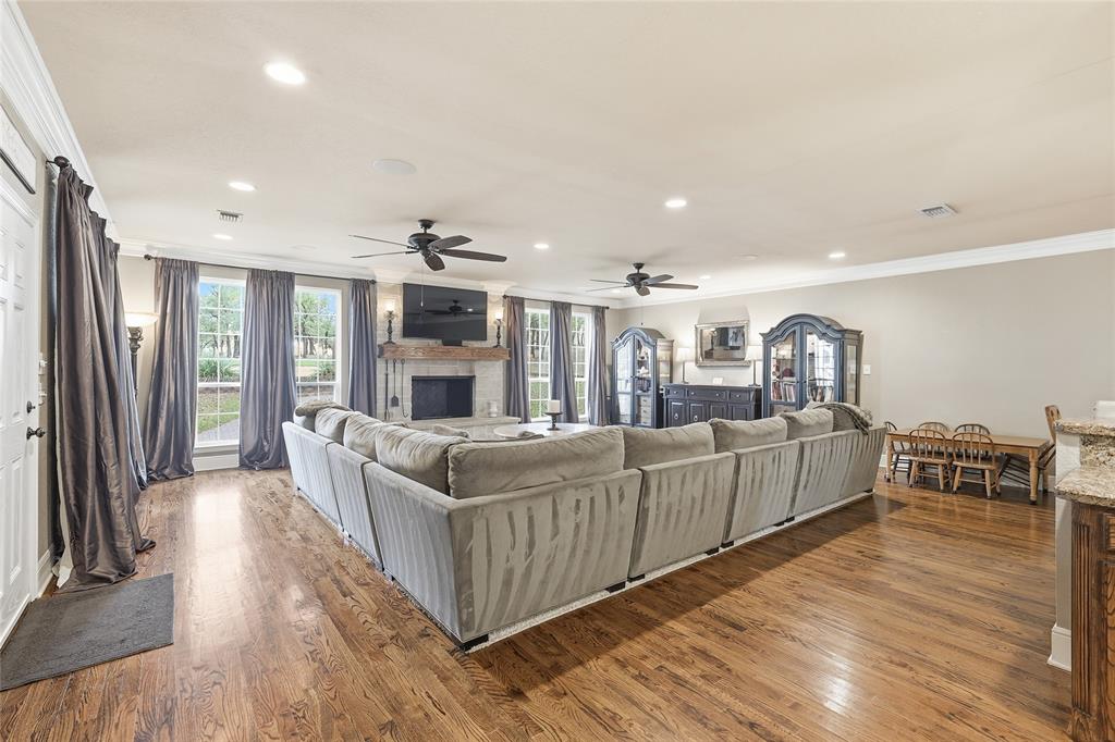 4800 Shiloh Road Double Oak, TX 75022 - Photo 31 of 40 a living room with furniture and a fireplace