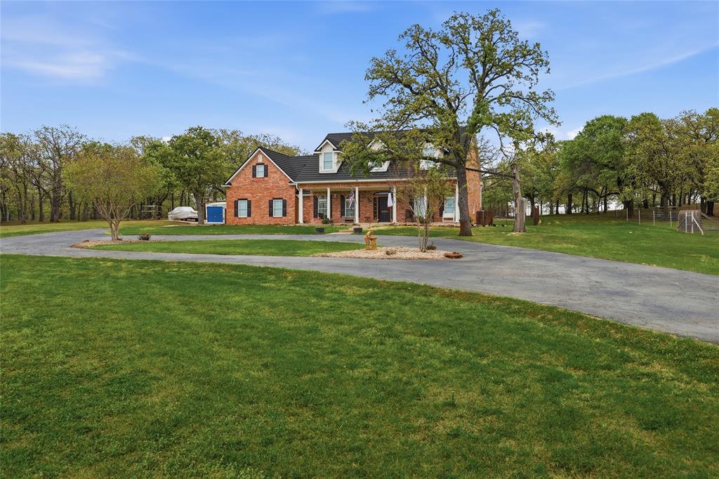 4800 Shiloh Road Double Oak, TX 75022 - Photo 40 of 40 a front view of house with yard and green space