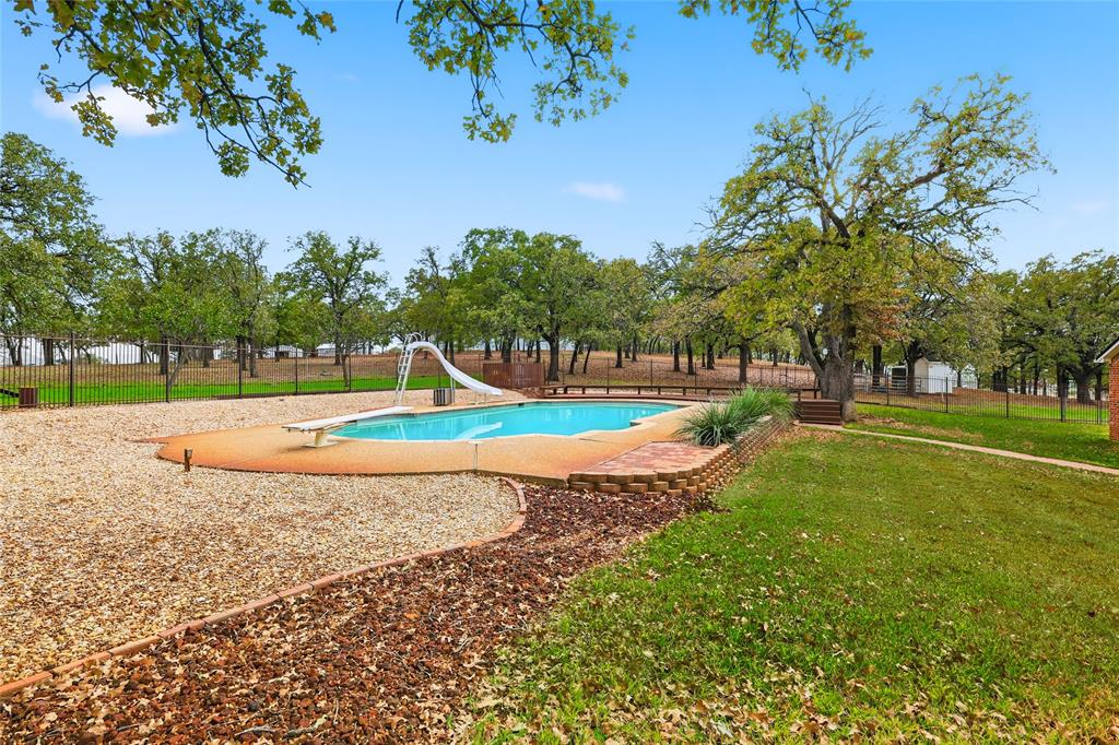 4800 Shiloh Road Double Oak, TX 75022 - Photo 5 of 40 a view of a park with swings and slides