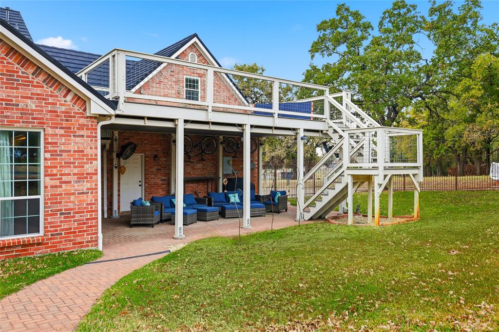 4800 Shiloh Road Double Oak, TX 75022 - Photo 7 of 40 a view of a house with a yard and sitting area