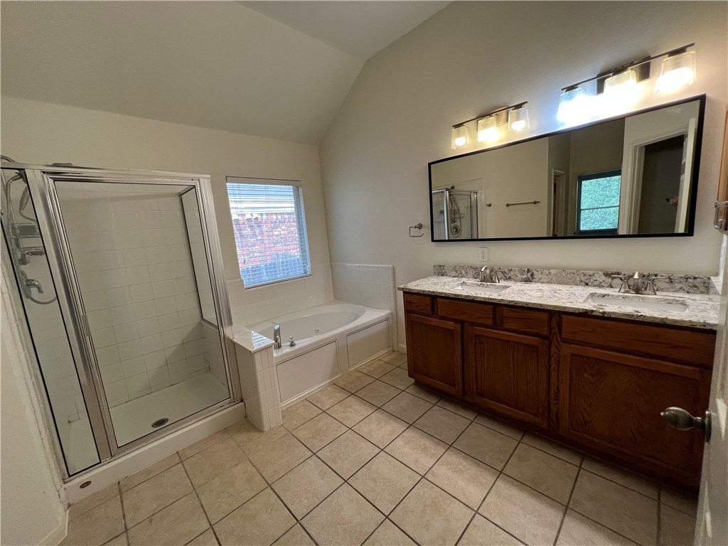 507 Red Hawk Drive Leander, TX 78641 - Photo 12 of 14 a spacious bathroom with a mirror sink and mirror