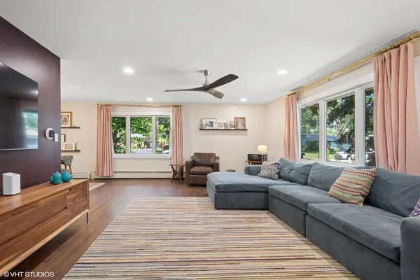 a living room with furniture and windows