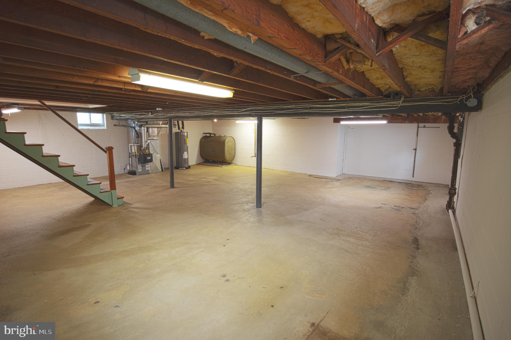 180 Carroll Road Pasadena, MD 21122 - Photo 21 of 28 Spacious basement ready for your vision.