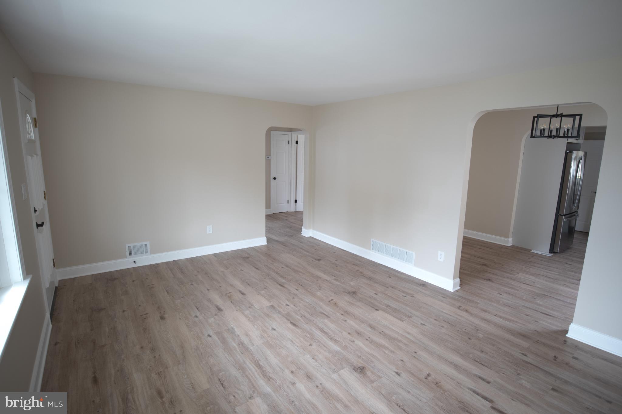 Spacious, light-filled living area awaits you.