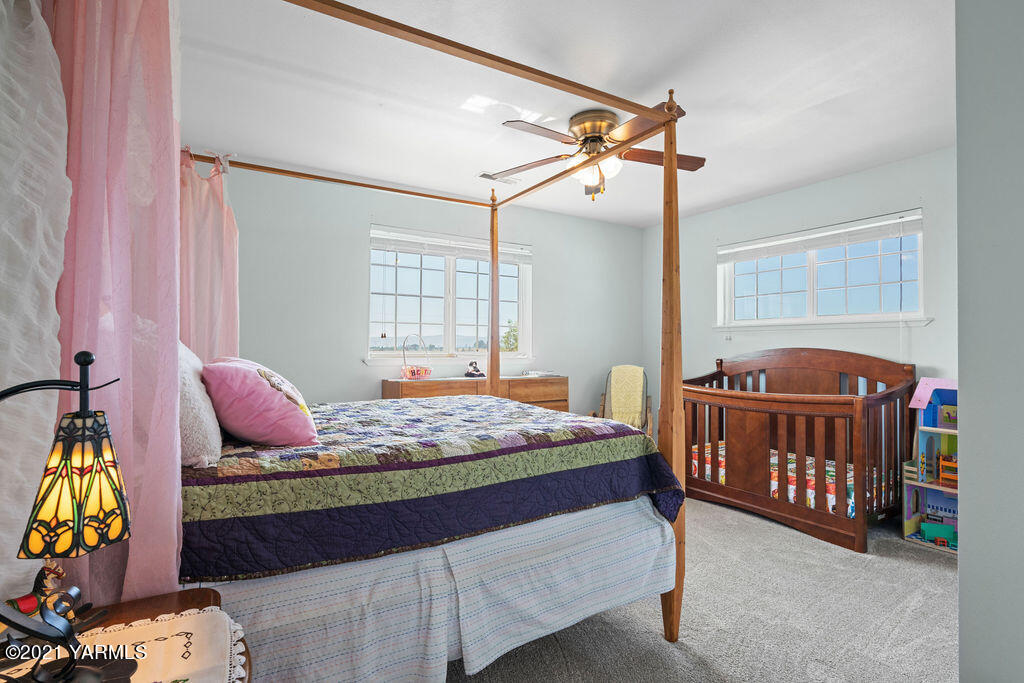 13050 West Barrett Road Yakima, WA 98908 - Photo 20 of 55 a bedroom with a bed window and dresser