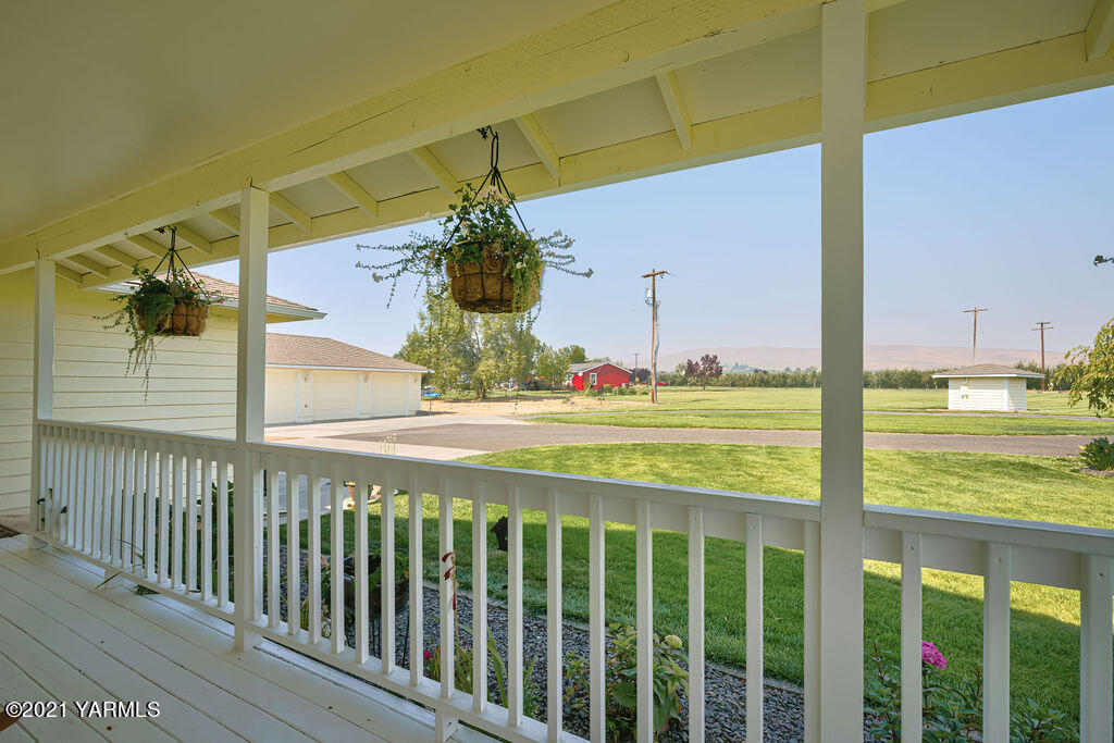 13050 West Barrett Road Yakima, WA 98908 - Photo 3 of 55 a view of a porch with a yard