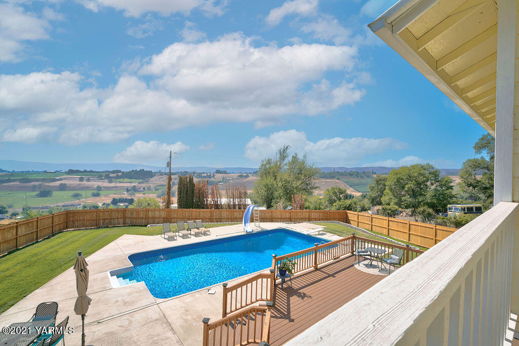 13050 West Barrett Road Yakima, WA 98908 - Photo 26 of 55 a view of swimming pool with a lounge chair