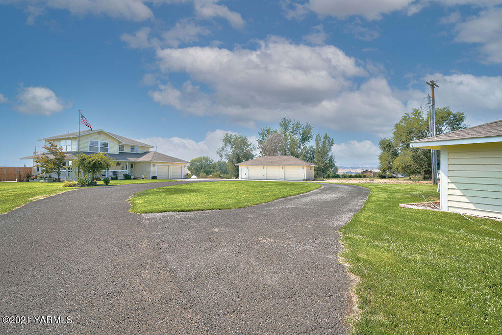 13050 West Barrett Road Yakima, WA 98908 - Photo 40 of 55 a view of a house with a big yard and large trees