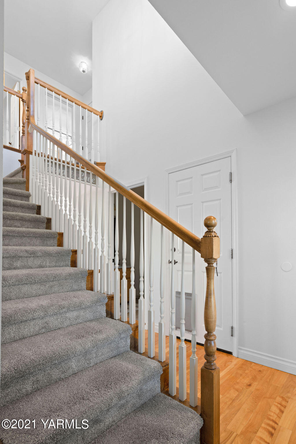 13050 West Barrett Road Yakima, WA 98908 - Photo 6 of 55 a view of staircase with lots of frames on wall and a window