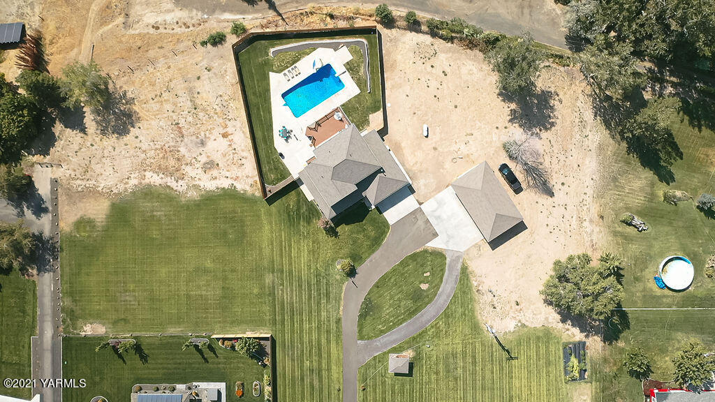13050 West Barrett Road Yakima, WA 98908 - Photo 52 of 55 with aerial view of a house with outdoor space and a lake view
