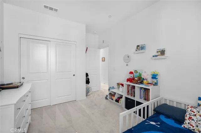 a bathroom with a sink mirror vanity and toilet