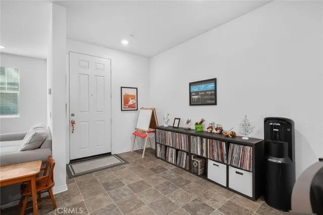 a view of a hallway with windows and closet