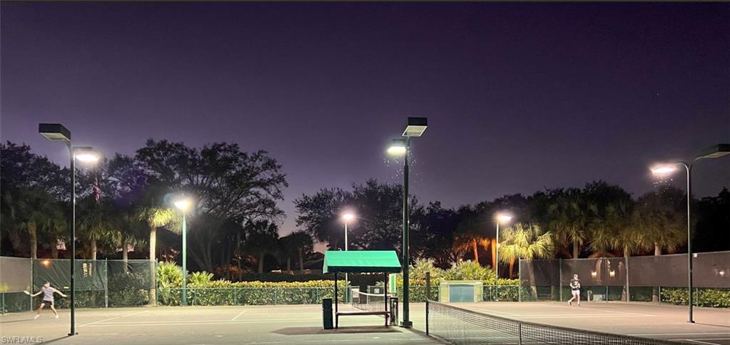 6842 Lantana Bridge Road, Unit 102 Naples, FL 34109 - Photo 32 of 49 Two tennis courts with lights