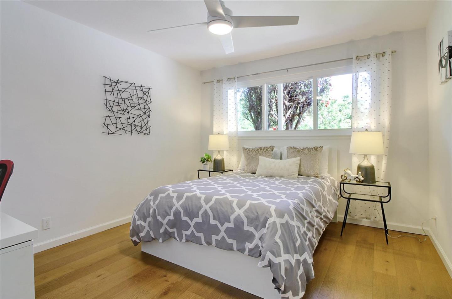 1435 Floyd Avenue Sunnyvale, CA 94087 - Photo 19 of 36 a bedroom with a bed and a window