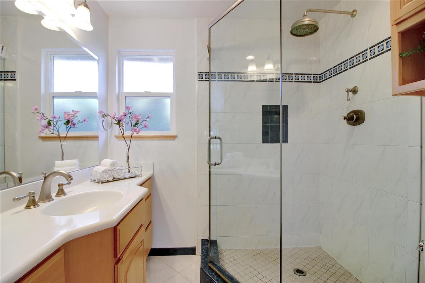 1435 Floyd Avenue Sunnyvale, CA 94087 - Photo 21 of 36 a bathroom with a double vanity sink mirror and shower
