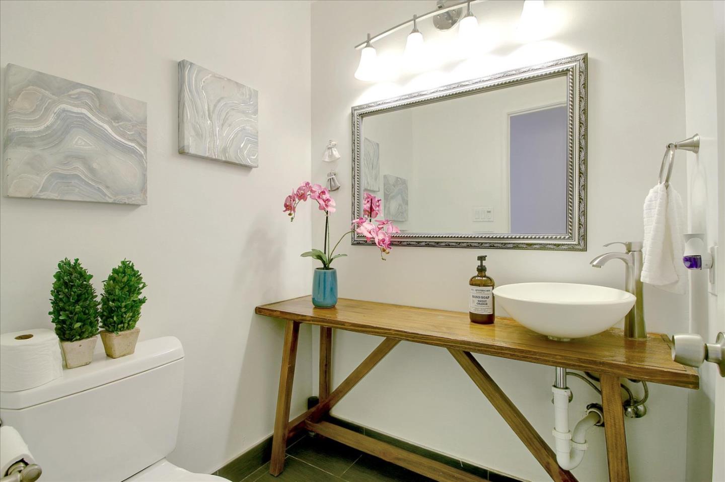 1435 Floyd Avenue Sunnyvale, CA 94087 - Photo 22 of 36 a bathroom with a sink and a mirror