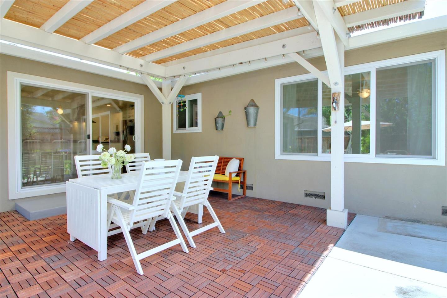 1435 Floyd Avenue Sunnyvale, CA 94087 - Photo 26 of 36 a view of a dining room with furniture wooden floor and a potted plant
