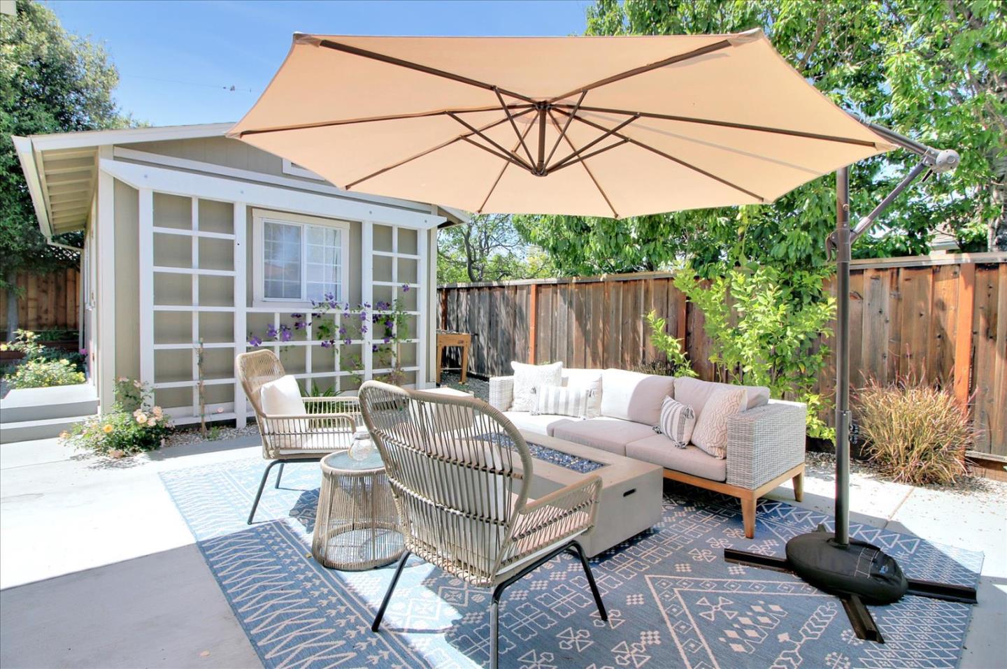 1435 Floyd Avenue Sunnyvale, CA 94087 - Photo 27 of 36 a view of a patio with a table and chairs under an umbrella