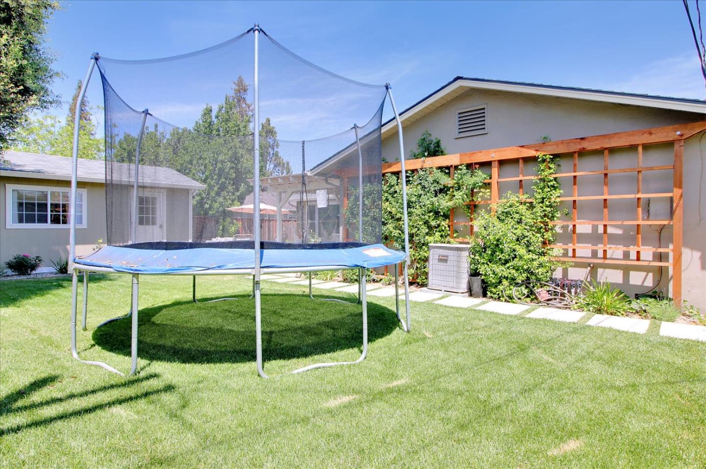 1435 Floyd Avenue Sunnyvale, CA 94087 - Photo 32 of 36 a view of a chair and table in the backyard of the house