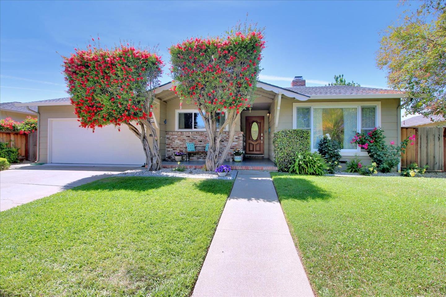 1435 Floyd Avenue Sunnyvale, CA 94087 - Photo 35 of 36 a front view of a house with a yard and potted plants