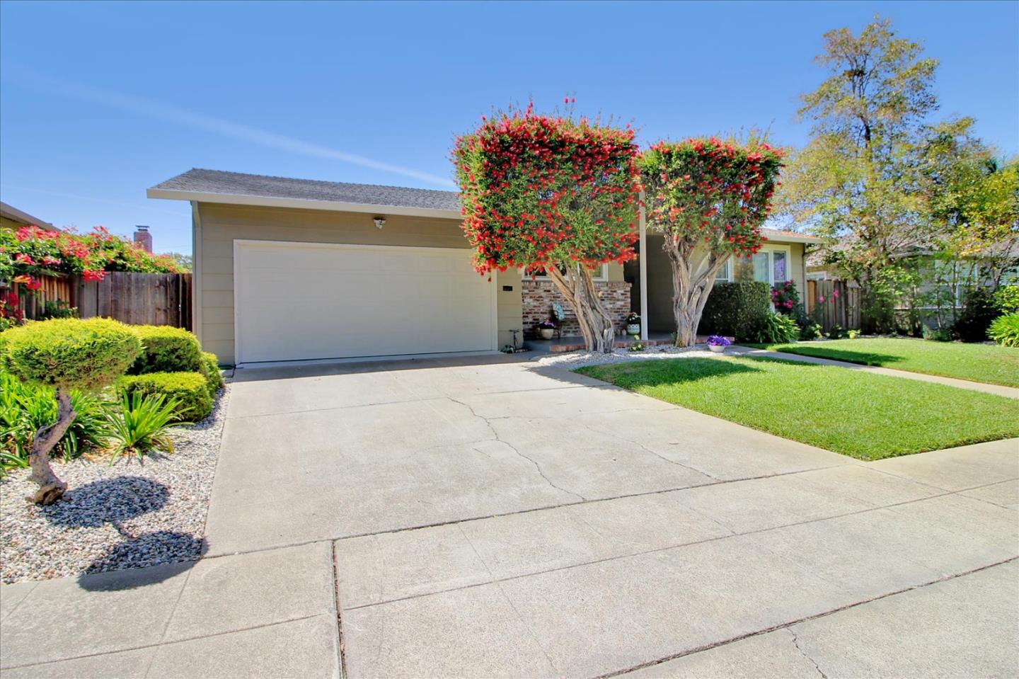1435 Floyd Avenue Sunnyvale, CA 94087 - Photo 36 of 36 a front view of a house with a yard and a garage