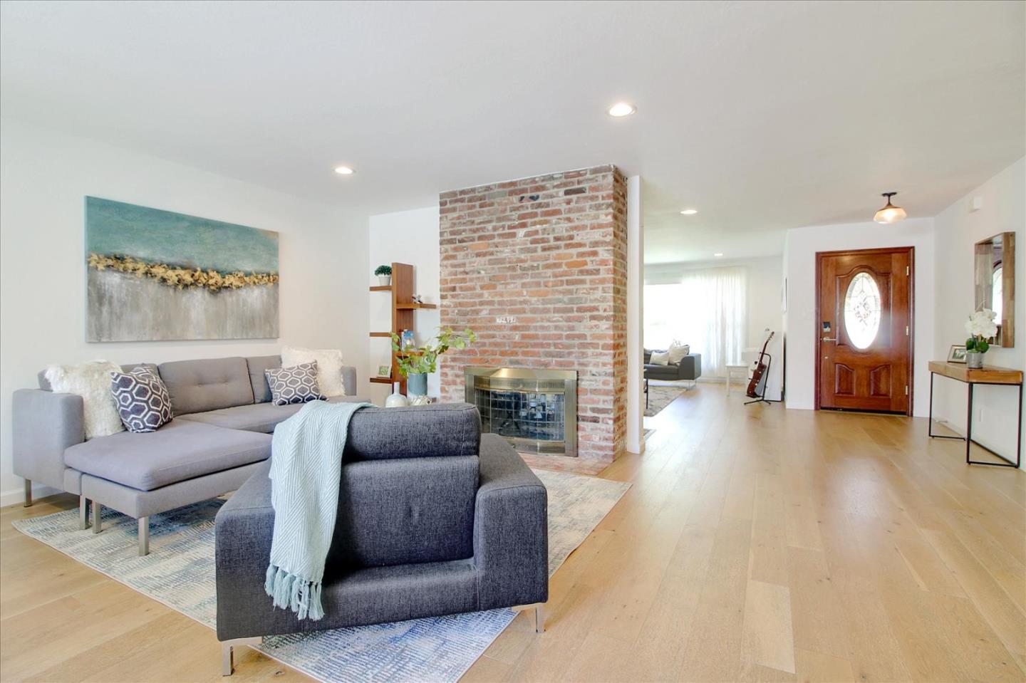 1435 Floyd Avenue Sunnyvale, CA 94087 - Photo 8 of 36 a living room with furniture and a fireplace