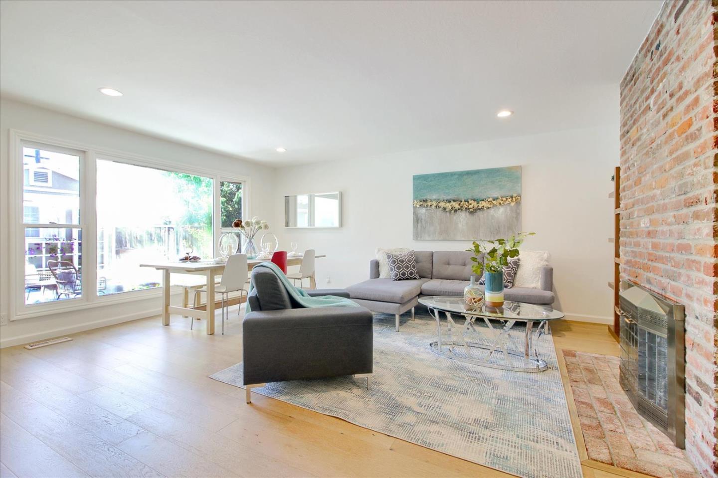 1435 Floyd Avenue Sunnyvale, CA 94087 - Photo 9 of 36 a living room with fireplace furniture and a large window