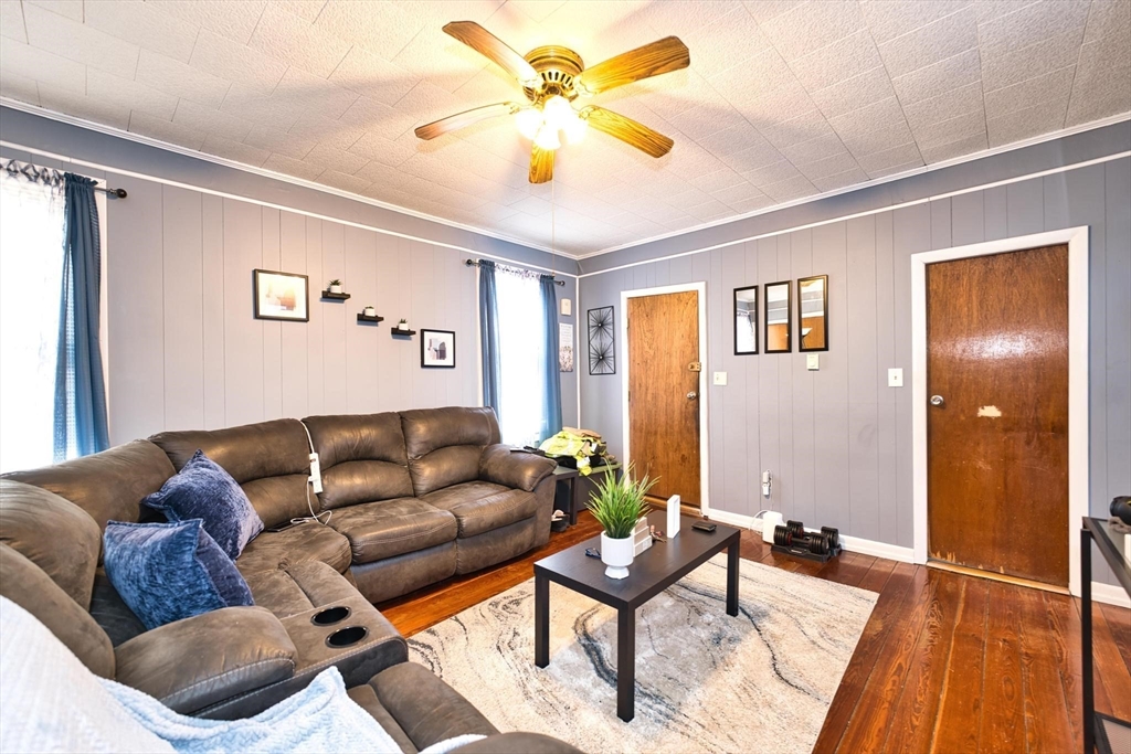 232 Alden Street Fall River, MA 02723 - Photo 9 of 34 a living room with furniture and a wooden floor