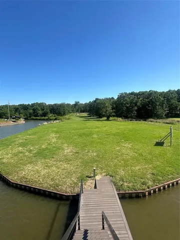a view of a lake with a big yard