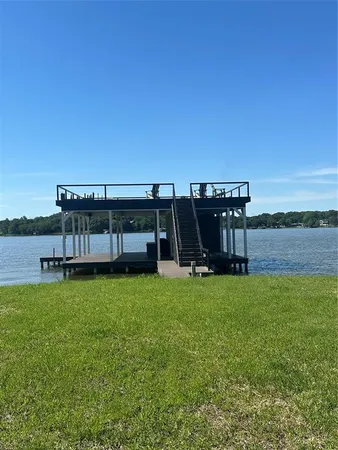 a view of a deck with a big yard