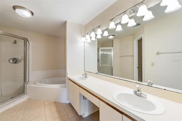 a bathroom with a bathtub a sink and a mirror