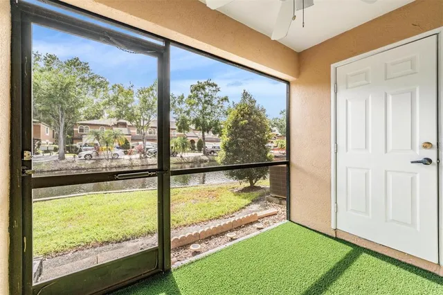 a view of an outdoor space and swimming pool in the back