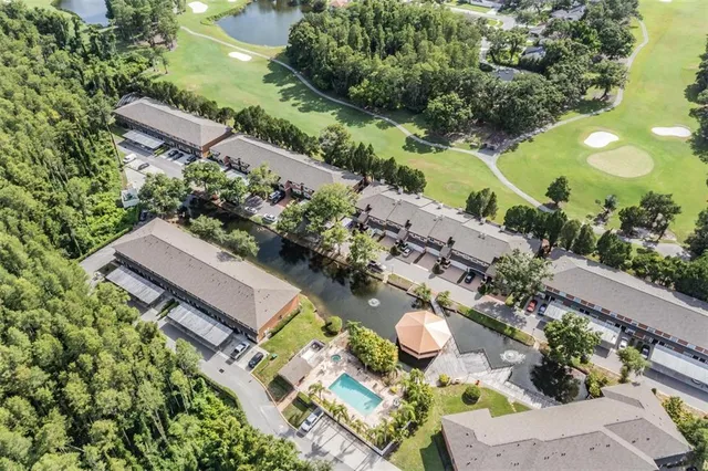 an aerial view of a chairs and table in the patio