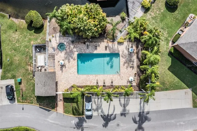 an aerial view of a house with a yard