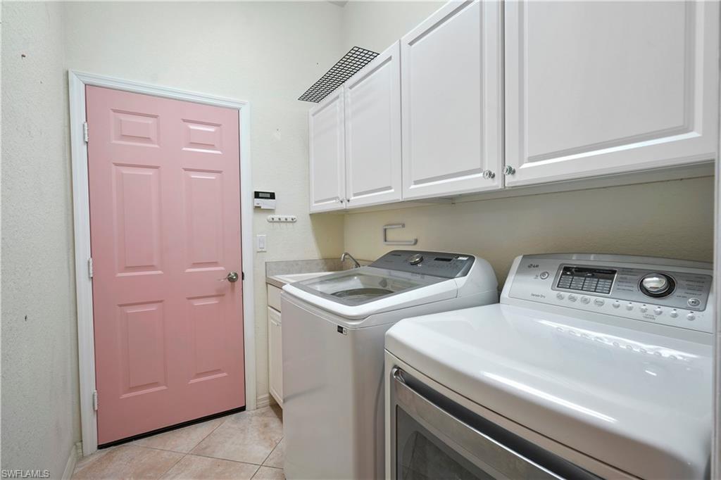 6522 Waverly Green Way Naples, FL 34110 - Photo 18 of 30 a utility room with dryer and washer