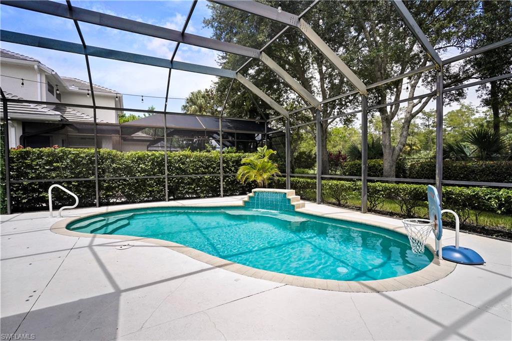 6522 Waverly Green Way Naples, FL 34110 - Photo 19 of 30 a view of a swimming pool with a sitting area