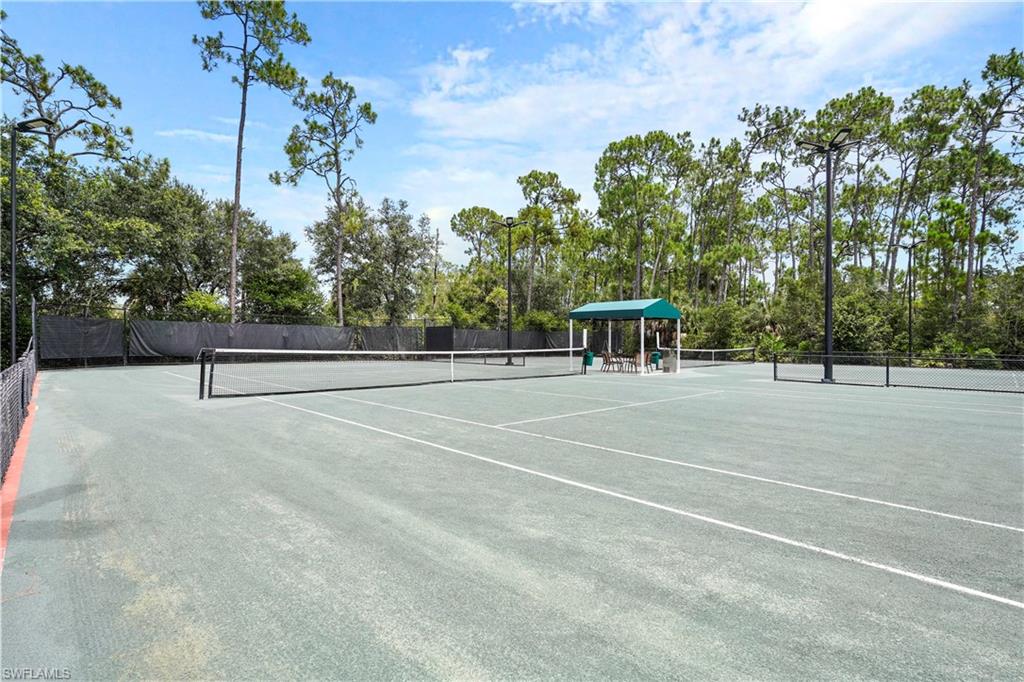 6522 Waverly Green Way Naples, FL 34110 - Photo 25 of 30 a view of a tennis court