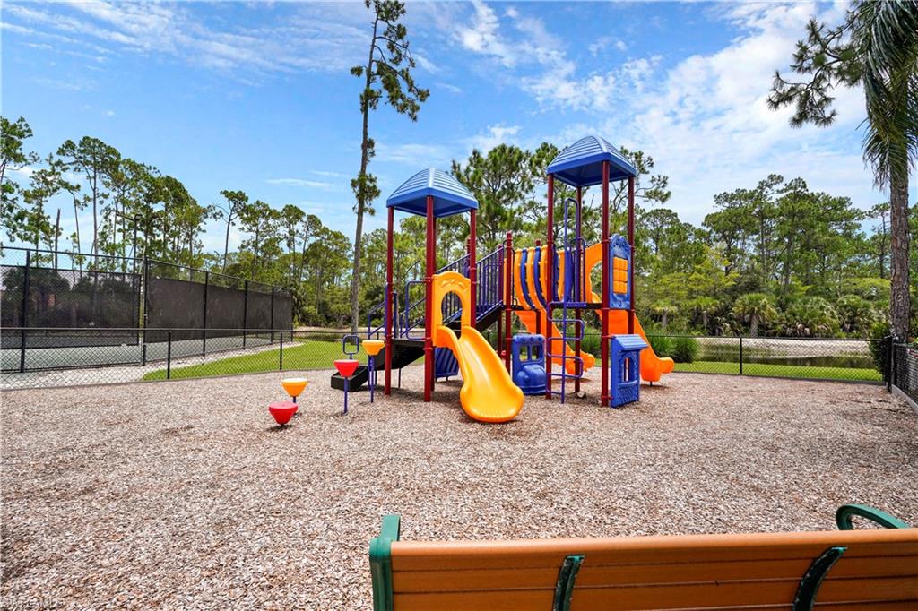 6522 Waverly Green Way Naples, FL 34110 - Photo 27 of 30 a view of outdoor space with garden
