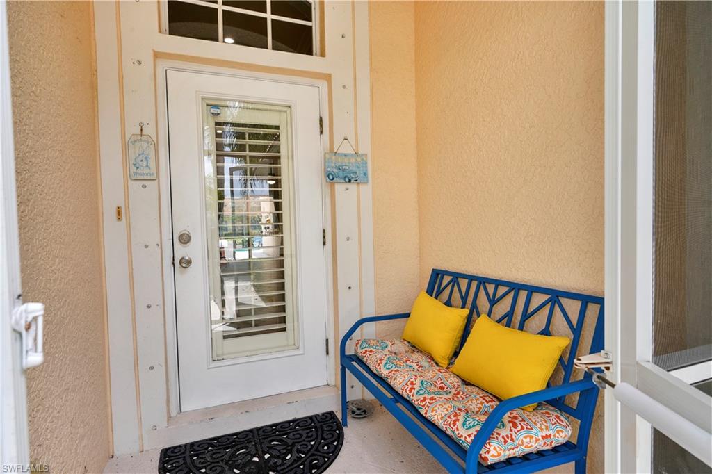 6522 Waverly Green Way Naples, FL 34110 - Photo 3 of 30 a bedroom with a bed and a window