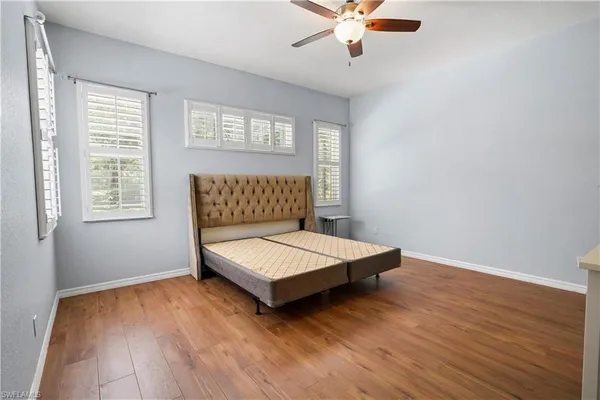 a living room with a bed furniture and a window