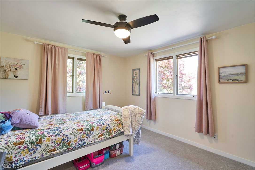 1535 Belle Meade Drive Akron, OH 44321 - Photo 11 of 33 Bedroom 2 with newer paint, ceiling fan and carpet