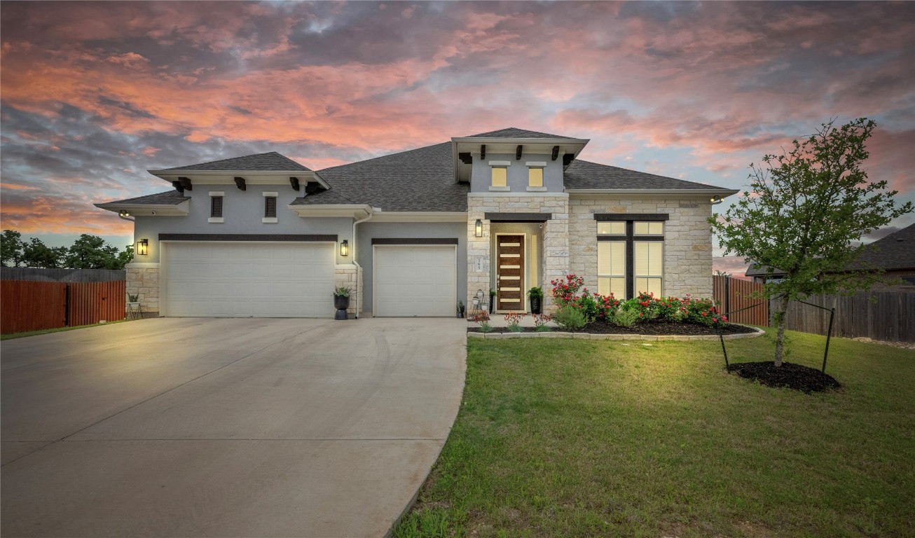 385 Lunar Loop Austin, TX 78737 - Photo 1 of 1 front view of a house with a yard