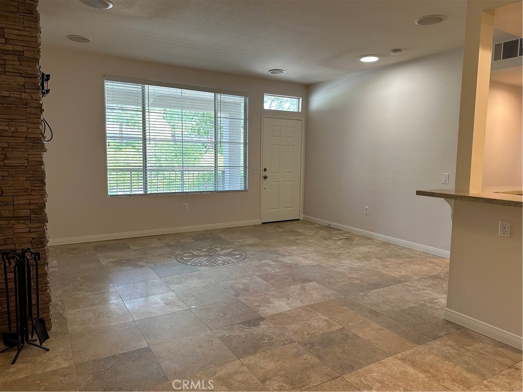 337 Chaumont Circle Lake Forest, CA 92610 - Photo 11 of 32 a view of an empty room with a window